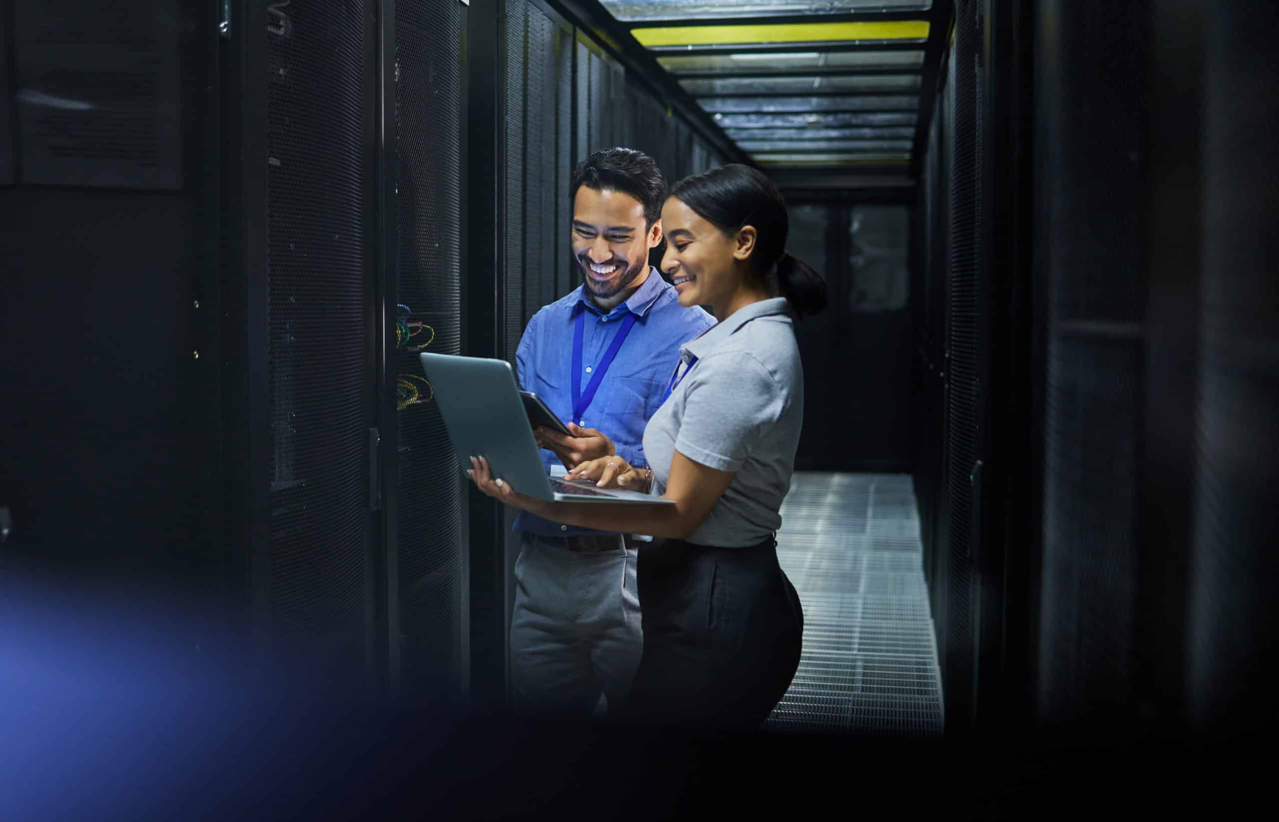 IT professionals managing enterprise data integration solutions in a secure data centre environment.